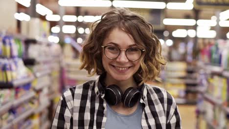Portrait-Young-Woman-Stands-In-Front-Of-The-Camera-And-Smiles-In-Supermarket-Feel-Happy-Girl-Shopping-Face-Retail-Store-1