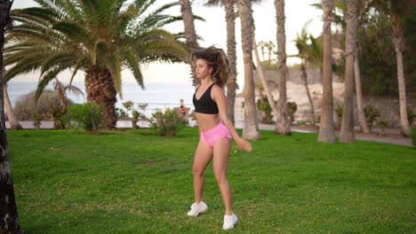 Fitness-Long-Haired-Woman-Does-Sport-Workout-In-At-Tropical-Park