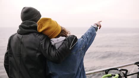 Young-Man-With-A-Girl-Standing-Hugging-On-Sea-Wooden-Pier,-Young-Couple-Enjoying-Time