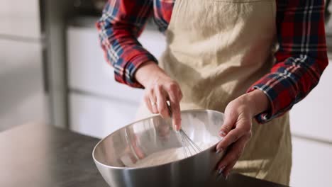 Young-Housewife-Mixing-Cake-Ingredients-In-Bowl