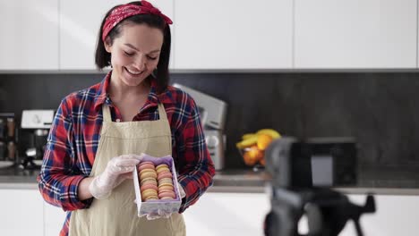 Woman-Pastry-Chef,-Demonstrating-Present-Box-With-Tasty-Macarons-To-Camera