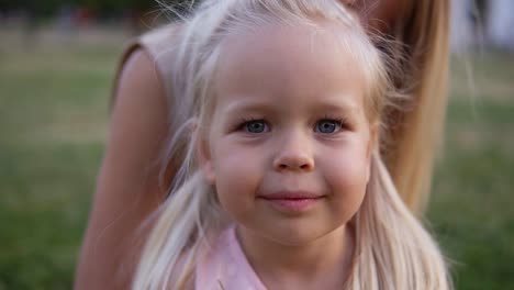Portrait-Little-Young-Girl-With-Blue-Eyes-Looking-At-Camera
