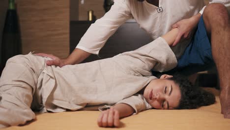 Young-Attractive-Woman-With-Her-Eyes-Closed-Is-Receiving-Thai-Massage