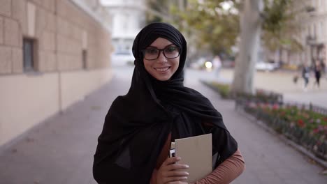 Portrait-Of-A-Pretty-Muslim-Woman-In-A-Black-Coloured-Traditional-Headscarf-1