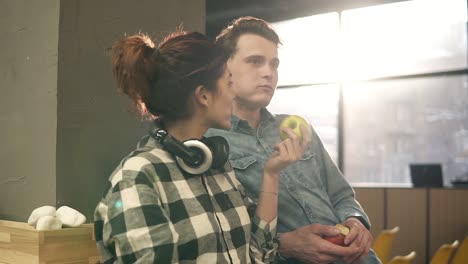 Cute-Attractive-Happy-Couple-Eating-Apples-From-Each-Others-Hands