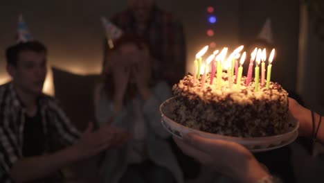 Happy-Smiling-Curly-Red-Haired-Girl-Blowing-Candles-Out-On-Her-Small-Birthday-Cake