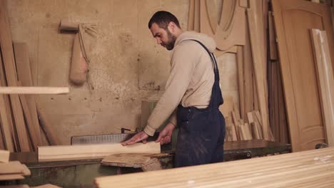 The-Carpenter-Cuts-Off-The-Sides-Of-The-Wood-Block-On-The-Circular-Saw