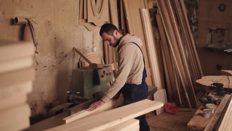 Side-View-Of-A-Craftman-Working-On-A-Electric-Saw-With-Wood