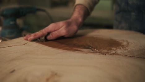 The-Carpenter-With-A-Rag-In-His-Hand-Processes-The-Wood-With-Oil-After-Grindering