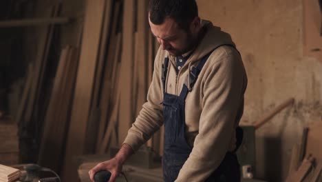 A-Footage-Of-A-Carpenter-Working-In-Overalls