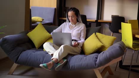 Stylish,-Young-Woman-With-Dreads-Working-On-Laptop-At-Home-Office-Or-Public-Workplace