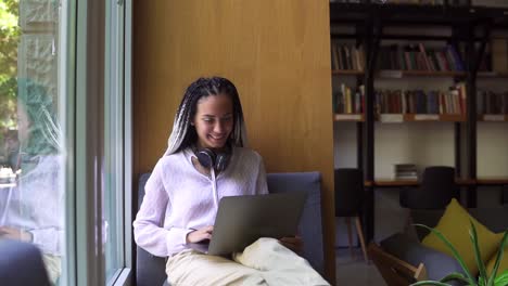Stylish,-Dreadlocks-Student-Working-On-Laptop-At-Library-Or-Workplace
