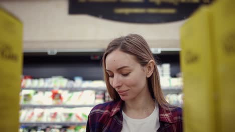 Footage-From-The-Shelf-Blonde-Woman-Picking-Corn-Flakes-From-The-Shelf