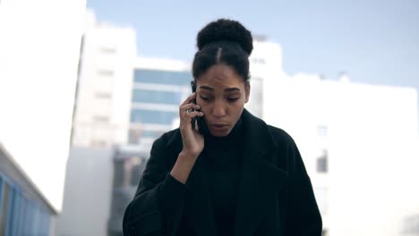 Low-Angle-Footage-Of-Black-Woman-Talking-On-Mobile-Phone-Solving-Business-Issues-Distantly