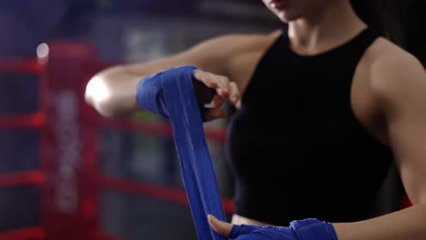 Woman-Fighter-Wraps-Her-Hands-With-Boxing-Bandages