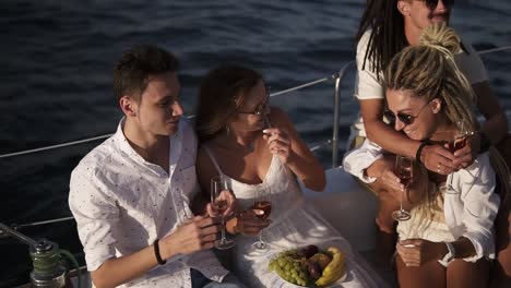 High-Angle-View-Of-4-Friends-Or-Couples-Spend-A-Weekend-On-A-Yacht-1