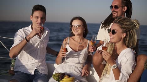 Cheerful-Friends-Or-Couples-Spend-A-Weekend-On-A-Yacht
