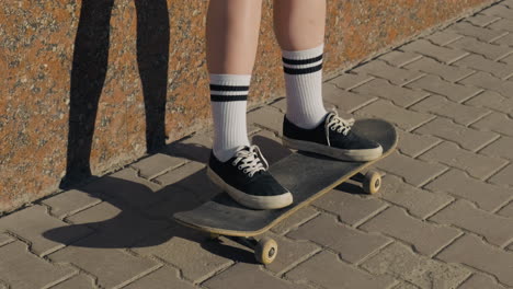 The-Feet-Of-An-Unrecognisable-Skater-Girl-On-A-Skateboard