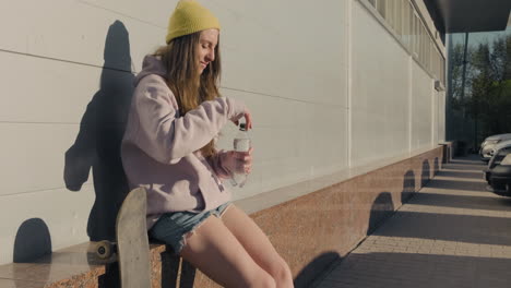 A-Skater-Girl-Waits-For-Someone-To-Sit-Down-And-Drink-Water