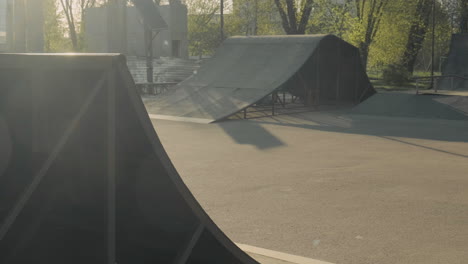 Young-Skater-Girl-Turning-On-A-Ramp-At-Sunset-In-A-Skate-Park-1