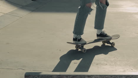 The-Feet-Of-An-Unrecognisable-Skater-Girl-Doing-Tricks-On-A-Skateboard-1