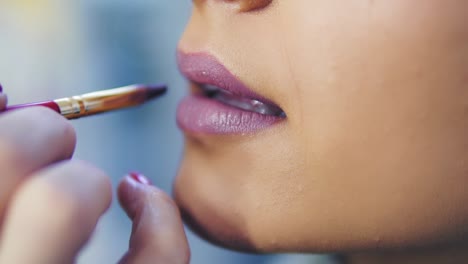 Closeup-View-Of-A-Professional-Makeup-Artist-Applying-Lipstick-On-Model's-Lips-Working-In-Beauty-Fashion-Industry-1
