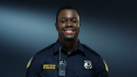 Portrait-Of-The-Young-Good-Looking-And-Cheerful-Policeman-Smiling-To-The-Camera