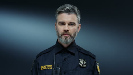 Portrait-Shot-Of-The-Good-Looking-Policeman-With-Serious-Face-And-In-The-Uniform-Looking-Straight-To-The-Camera
