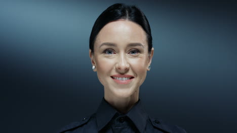 Close-Up-Of-The-Young-Beautiful-Brunette-Woman-From-Police-Turning-Face-To-The-Camera-And-Smiling-Cheerfully