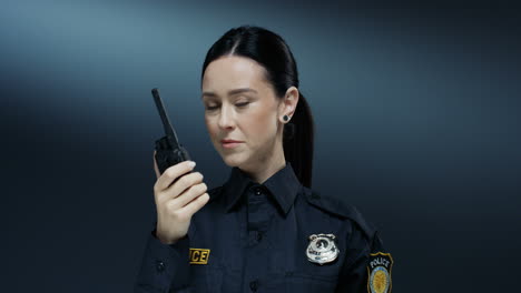 Close-Up-Of-The-Pretty-Policewoman-Talking-In-The-Walkie-Talkie-And-Listening-An-Answer-While-Doing-A-Work-Task