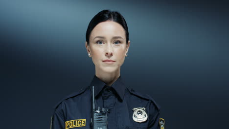 Portrait-Shot-Of-The-Beautiful-Policewoman-With-Serious-Face-And-In-The-Uniform-Looking-Straight-To-The-Camera
