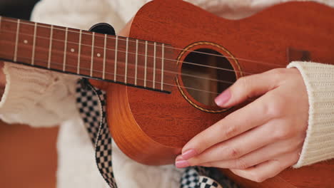 The-Hands-Of-An-Unrecognizable-Girl-Playing-The-Ukelele-1