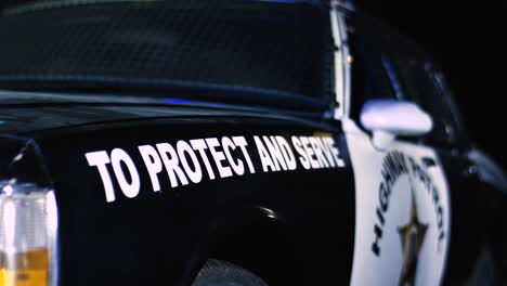 Close-Up-Of-The-Police-Car-From-The-Side-At-Night