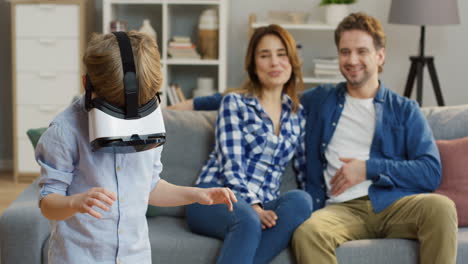 Small-Cute-Boy-In-The-Vr-Glasses-Having-A-Vr-Headset-In-The-Living-Room