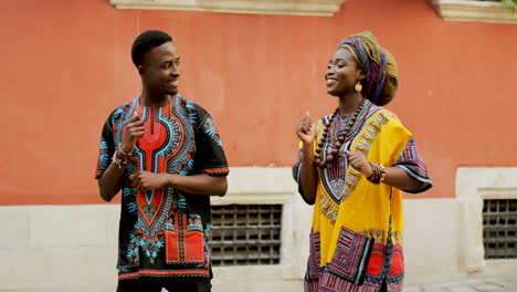 Young-Stylish-Happy-And-Cheerful-Attractive-Man-And-Woman-In-The-Traditional-Costumes-Dancing-On-The-Street-And-Laughing