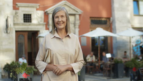 Portrait-Of-Beautiful-Gray-Haired-Old-Woman-In-Elegant-Style-Smiling-To-Camera-Outdoors