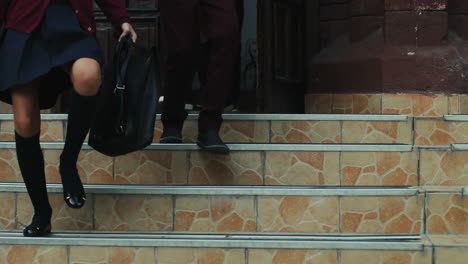 Close-Up-Of-The-Feet-Of-Schoolboys-And-Schoolgirls-In-The-School-Uniforms-Running-Down-The-School-Stairs-After-Classes