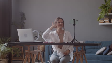 Cute-Vlogger-Doing-A-Live-Streaming-And-Creating-The-Shape-Of-A-Heart-With-Her-Fingers
