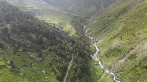 Aerial-Shot-Of-A-Beautiful-River-Flowing-Between-The-Green-Slopes-Of-Two-Mountains-In-The-Pyrenees