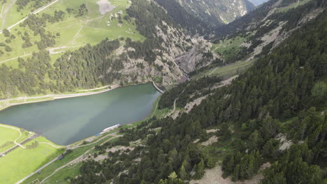 Aerial-View-Of-A-Dam-Located-On-A-Mountainside-In-The-Pyrenees