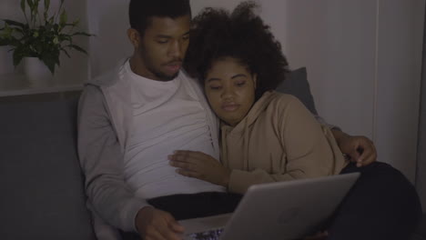 Young-Couple-Watching-A-Movie-On-The-Laptop