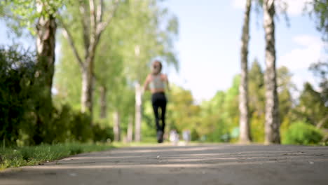 Back-View-Of-A-Sportswoman-Running-At-The-Park-In-A-Sunny-Day