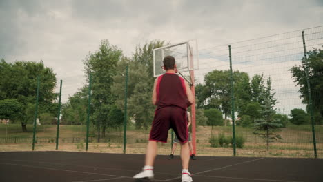 Two-Male-Basketball-Players-Training-Together-In-An-Outdoor-Basketball-Court-2