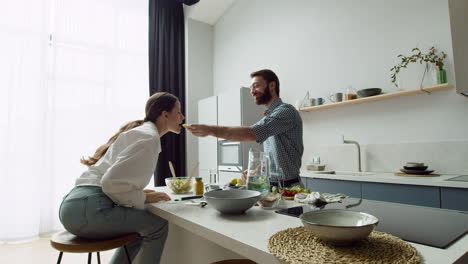 Cheerful-Loving-Couple-In-A-Modern-Kitchen