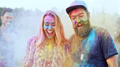 Close-Up-Of-The-Jhappy-Couple-In-Colorful-Paints-At-The-Holi-Fest-Celebration-Hufing-And-Smiling-To-The-Camera