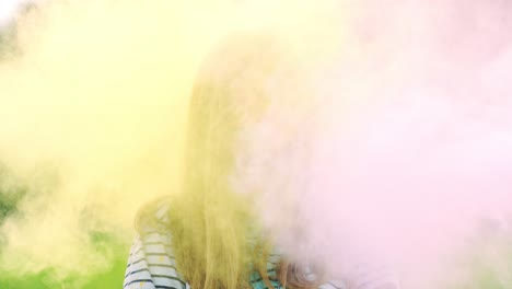 Portrait-Of-The-Young-Joyful-Girl-Smiling-While-Standing-Outdoors-In-Paint-Powder-In-Holi-Festival