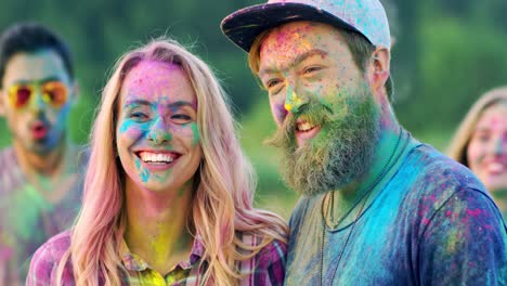Close-Up-Of-The-Beautiful-And-Joyful-Couple-Having-Fun-At-The-Holi-Festival-While-Standing-Outdoor-And-Smiling-In-Paint-Powder