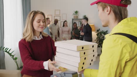 Delivery-Man-Gives-Several-Pizza-Boxes-To-A-Girl-At-Home-1