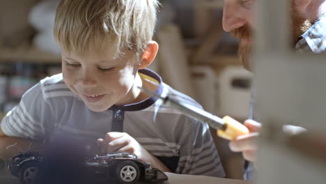 Child-Builds-An-Electric-Car-In-The-Craft-Workshop