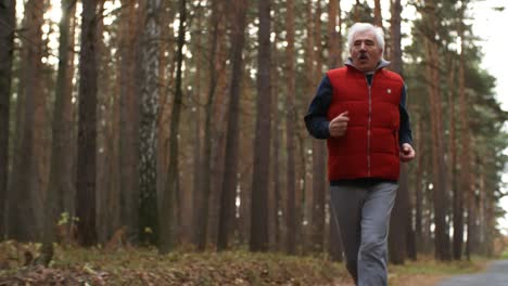 Happy-Senior-Man-Running-In-The-Forest